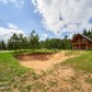 Малое фото - Деревянный дом в живописном месте, окруженном соснами — 22